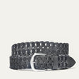 Black woven leather W Link belt coiled flat, showing the full herringbone braid and brushed silver buckle