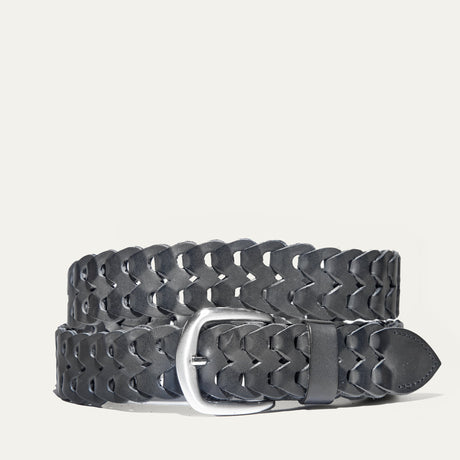 Black woven leather W Link belt coiled flat, showing the full herringbone braid and brushed silver buckle