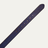 Close-up of the brown and blue diamond-embossed leather belt strap tip end with adjustment holes.