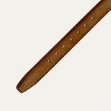 Close-up of the cognac nubuck belt strap showing buckle holes and contrast stitching detail