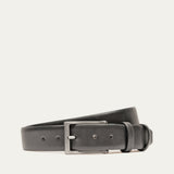 Will Leather Goods Glazed Calfskin Belt in black, coiled flat showing the polished leather strap, brushed silver prong buckle, and keeper loop, on a white background.