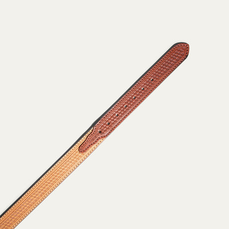Close-up of the chestnut-to-natural two-tone basketweave belt strap tip end with adjustment holes.