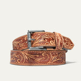 Hand-Tooled Morning Glory Jean Belt by WILL Leather Goods in natural tan leather with a hand-tooled floral pattern and antique nickel buckle, coiled front product view on a white background.