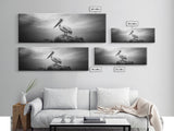 Coastal Pelican, Ocean Rock, Tranquil Wildlife Scene, Framed Canvas Print, Beach House Wall Art, Seaside Nature Decor, Moody Tones