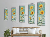 Japanese Skinny Art of Sunflowers with Golden Petals and Verdant Stems on a Pastel Blue Background – Framed Canvas Print