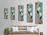 Pair Of Cranes Perched On Branch Against Orange Sun Background Skinny Art Wood Block Print Framed Canvas Print