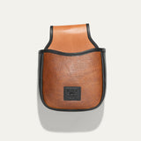 Will Leather Goods Ammo Belt Bag in cognac pebbled leather with black trim, back product view showing the embossed WILL leather patch and belt loop tab, on a white background.