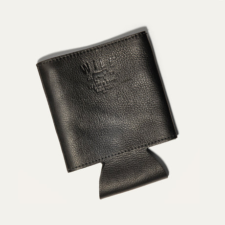 Will Leather Goods Leather Bottle & Can Holder in black leather, empty koozie shown at an angle with the embossed WILL cattle-brand logo, on a white background.