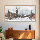 Snowy church scene framed canvas print, stained glass church in winter with snow-covered rooftops, perfect Christmas or holiday art display