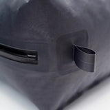Close-up of a TILLIV Kamper corner showing the flat webbing anchor loop and the airtight zipper