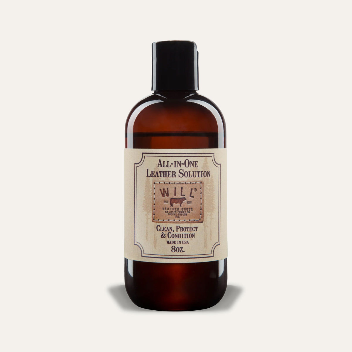Will Leather Goods All-In-One Leather Solution, 8oz amber glass bottle with black cap and cream label reading Clean, Protect & Condition, Made in USA, studio shot on a white background.