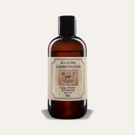 Will Leather Goods All-In-One Leather Solution, 8oz amber glass bottle with black cap and cream label reading Clean, Protect & Condition, Made in USA, studio shot on a white background.