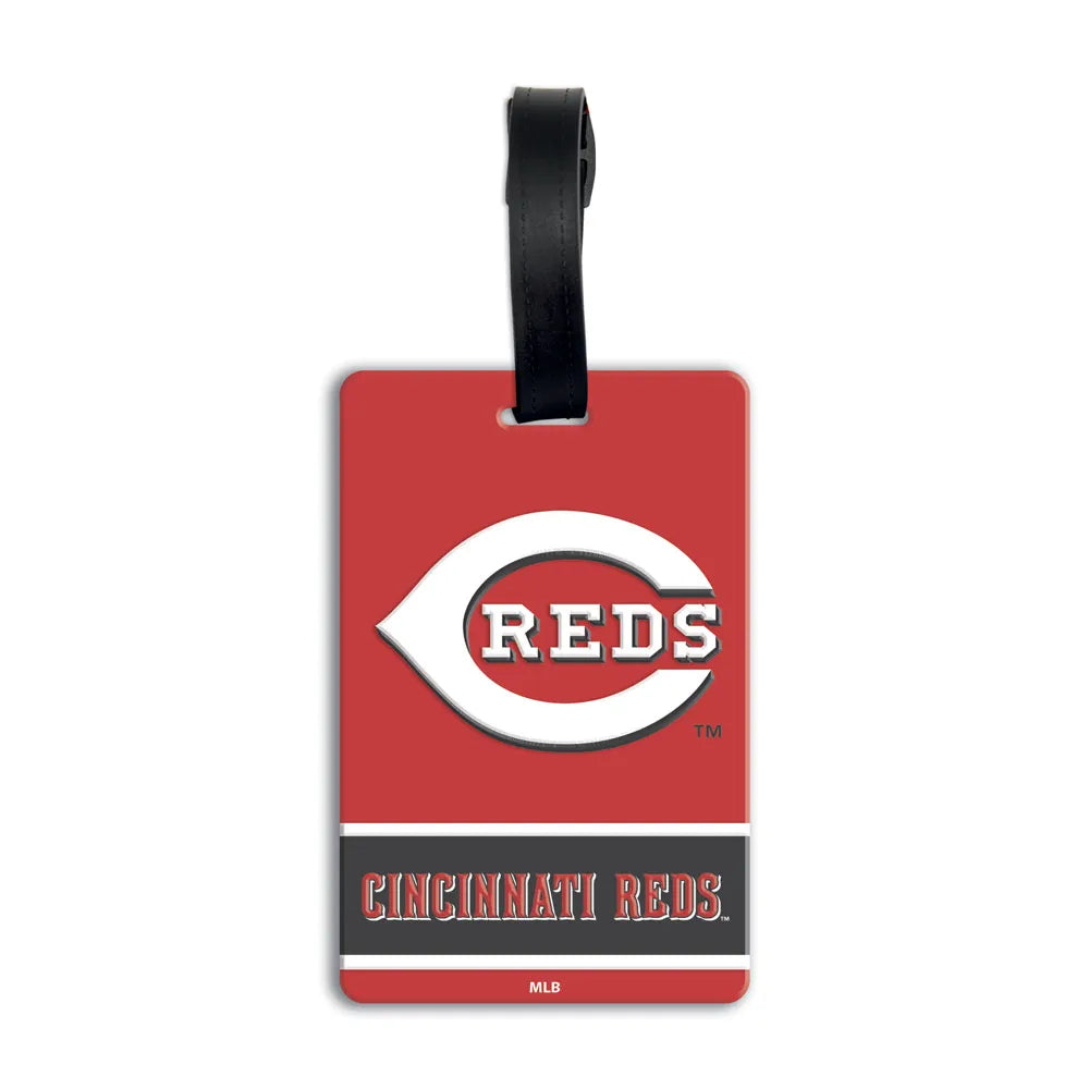An official Cincinnati Reds luggage tag featuring the red 'C' logo with 'Reds' script and the 'Cincinnati Reds' wordmark on a red background with a black hanging strap. MLB PVC Luggage Bag Tag