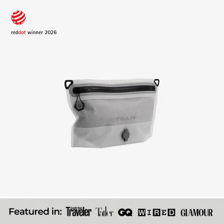 TILLIV Compak Small in Digital White, part-filled and seen at an angle, above a strip reading Featured in Conde Nast Traveler, Tatler, GQ, WIRED and GLAMOUR