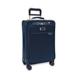 Blue suitcase with wheels on a white background